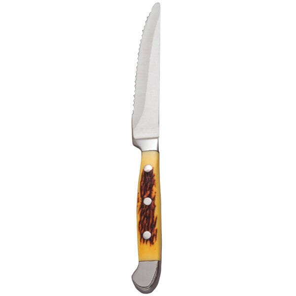 A Libbey steak knife with a yellow POM handle and a metal blade.