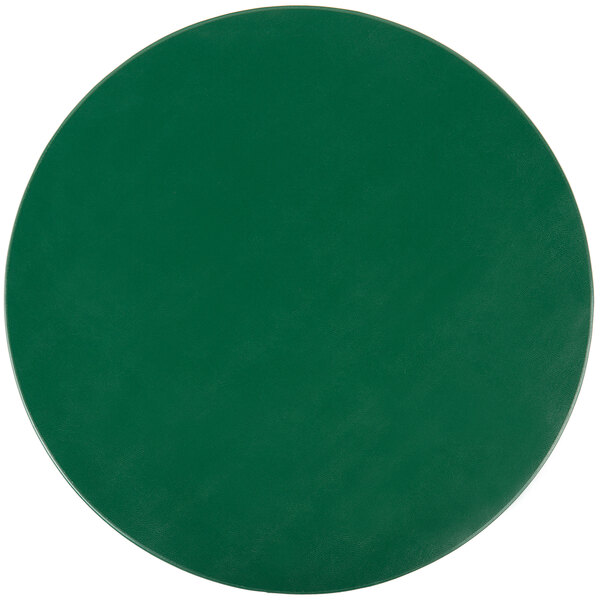 A green vinyl round placemat with a white circle.