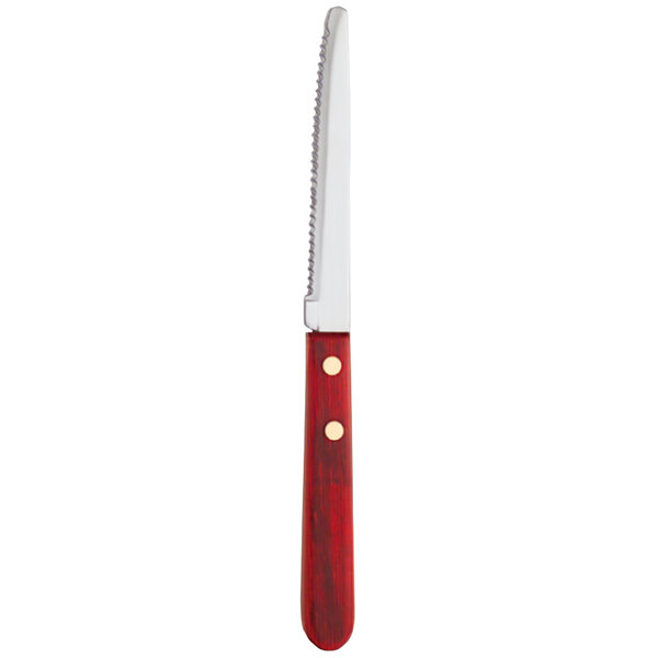 A Libbey stainless steel steak knife with a red Pakkawood handle.