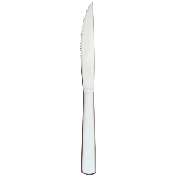 A close-up of a Libbey steak knife with a white handle.