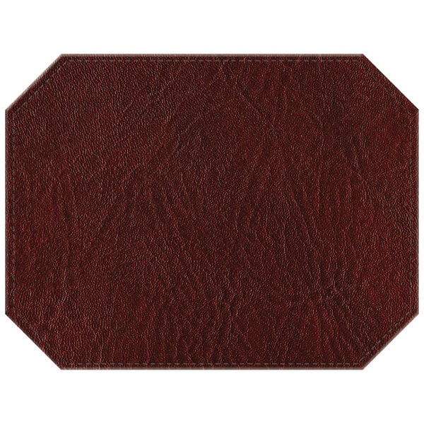 A white hardboard octagon placemat with brown faux leather and stitching in a wine design.