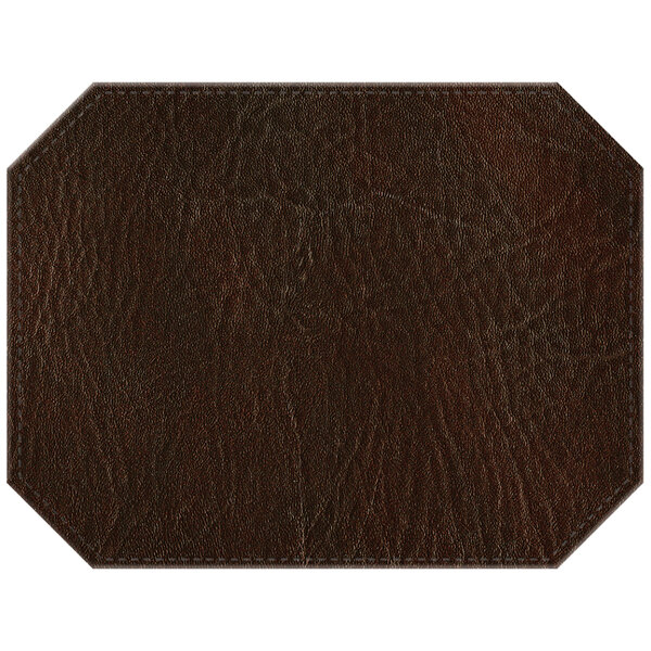 A brown hardboard and faux leather octagon placemat.
