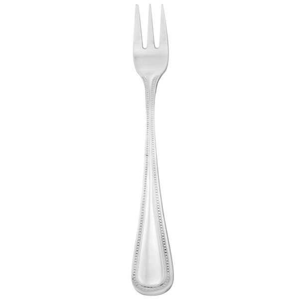 A silver Walco Classic Bead cocktail fork with a white handle.