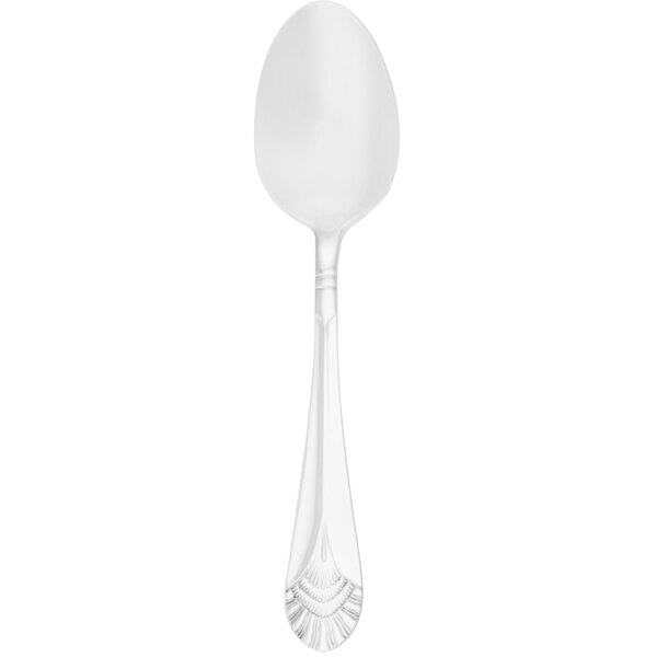 A Walco stainless steel serving spoon with a white handle.