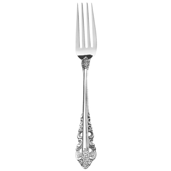 A close-up of a Walco stainless steel table fork with a decorative Baroque handle.