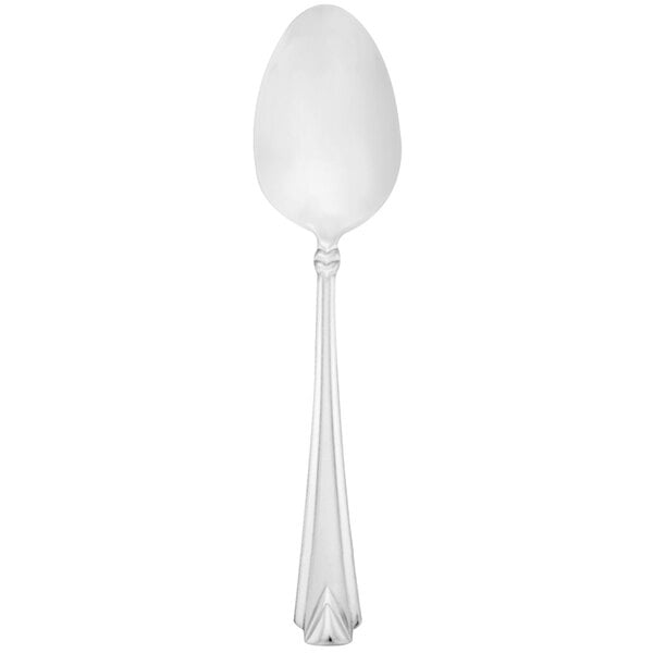 A Walco stainless steel dessert spoon with a pointy design on the handle on a white background.