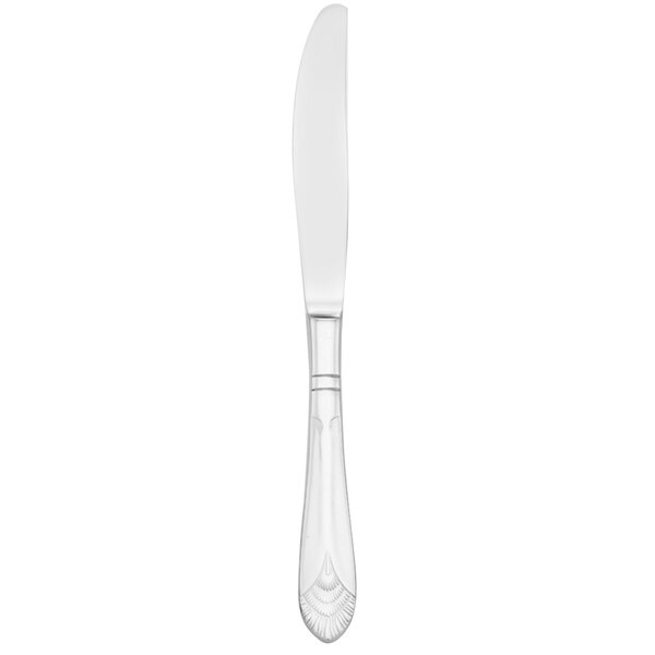 A silver Walco European table knife with a white handle.