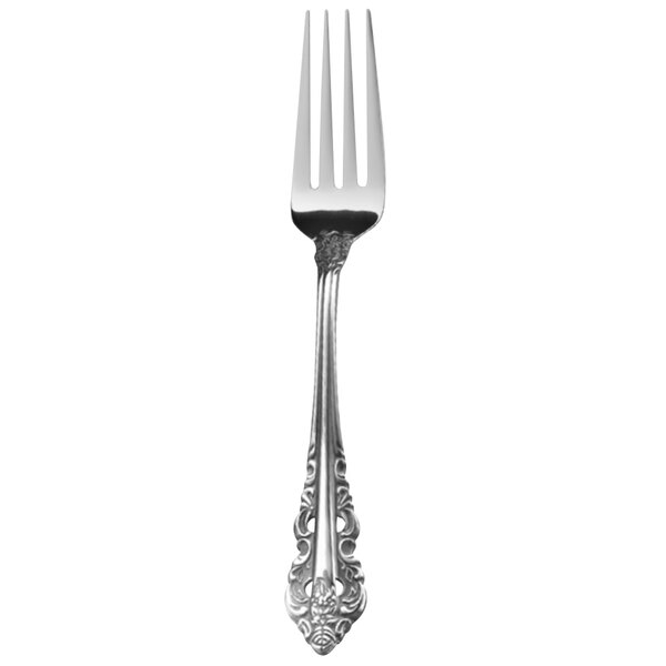 A Walco stainless steel dinner fork with a Baroque pattern on the handle.