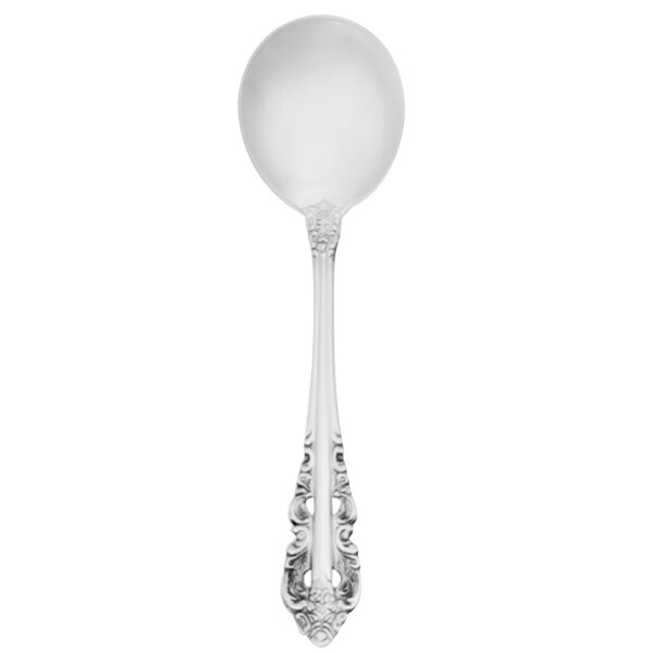 A Walco stainless steel bouillon spoon with a Baroque design on the handle.