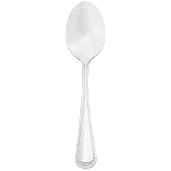 A silver spoon with a white handle.