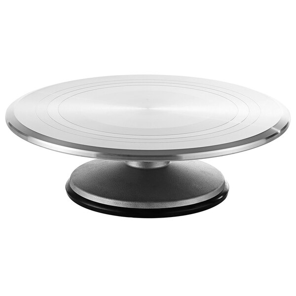 A silver stainless steel Matfer Bourgeat revolving cake stand with a black circular base.