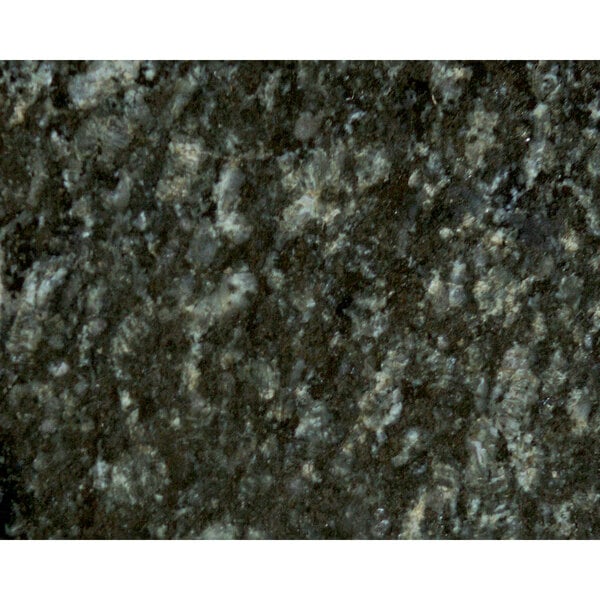 A close-up of an Uba Tuba granite table top.