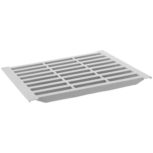 A white plastic grate with rows of holes.