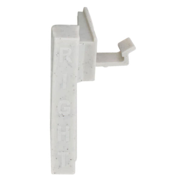 A white plastic piece with the text "Camshelving Premium" on it.