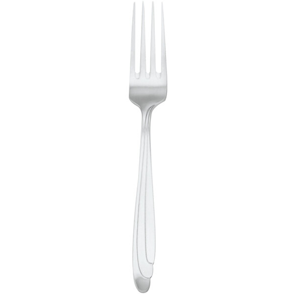 A silver Walco European table fork with a white handle.