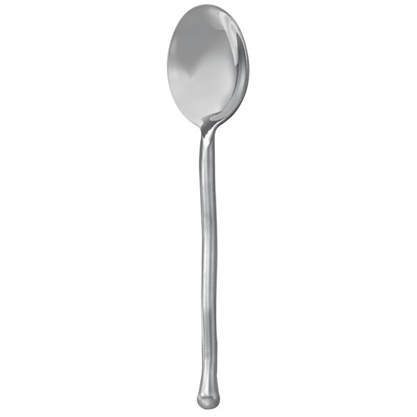 A close up of a Walco stainless steel teaspoon with a long silver handle.
