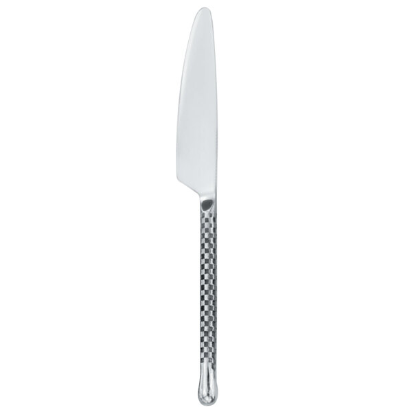 A Walco stainless steel dinner knife with a checkered silver handle.