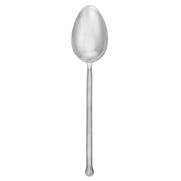 A Walco stainless steel serving spoon with a long, cylindrical handle.
