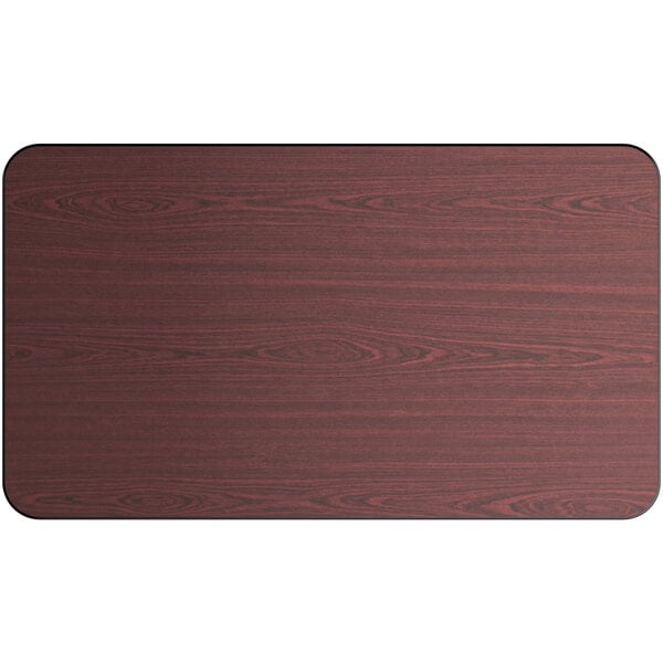 A Lancaster Table & Seating rectangular wood table top with a reversible wood surface in cherry and black.