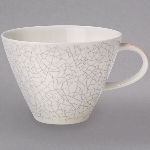 A white Villeroy & Boch Terra porcelain coffee cup with a crack pattern in brown.