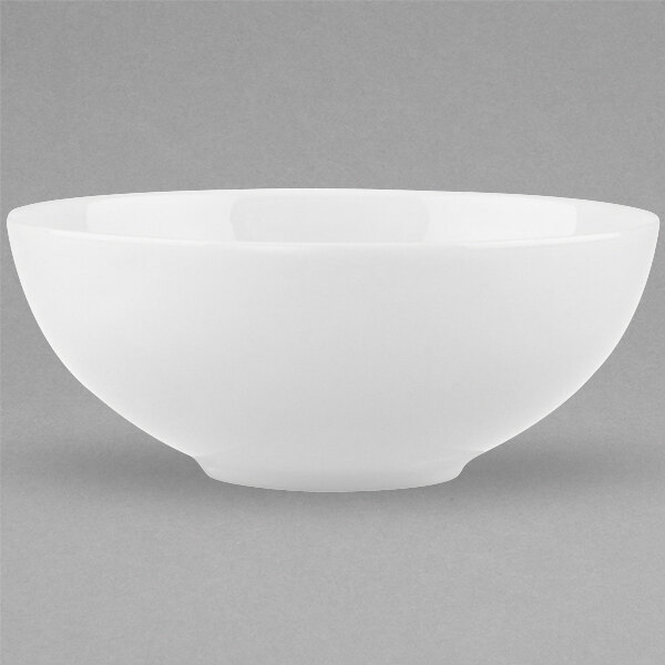 A close-up of a Villeroy & Boch white bone porcelain bowl with a white rim.