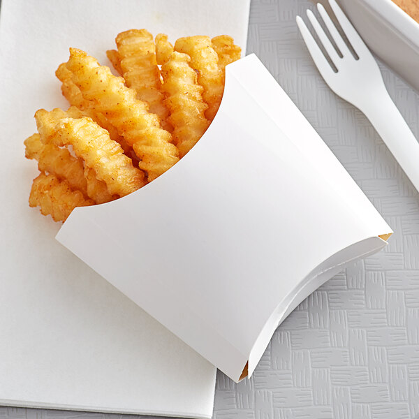 A white paper tray with French fries and a fork.