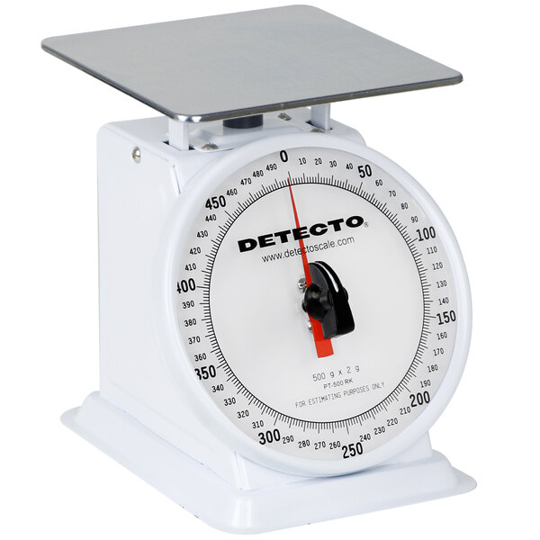 A white Cardinal Detecto portion scale with a metal base and a black rotating dial.