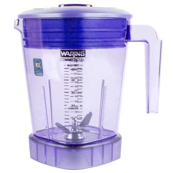 A purple Waring blender jar with a clear lid and a blue handle.