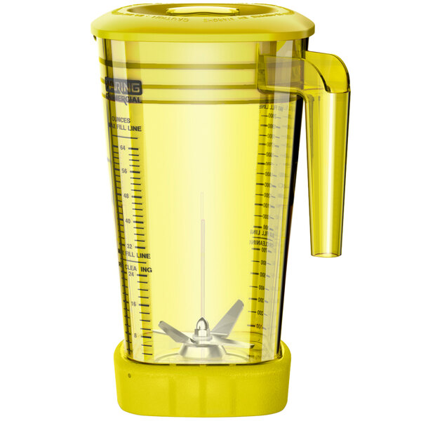 A yellow Waring blender jar with a handle and lid.