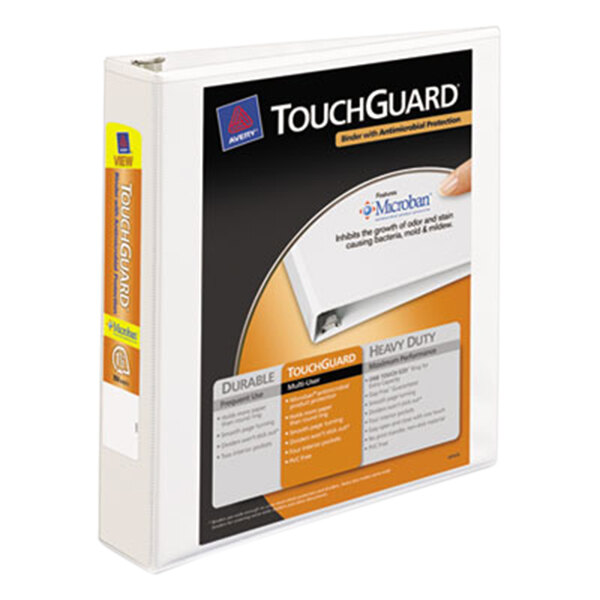 A hand holding a white box with a black and orange TouchGuard logo and a yellow label with a black and orange design.