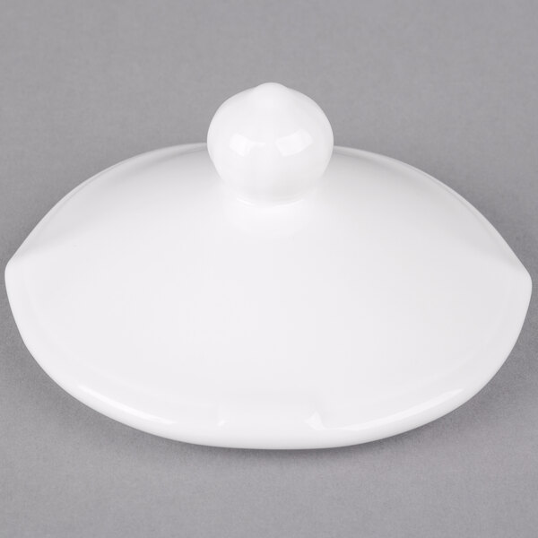A Villeroy & Boch white porcelain lid with a round knob.