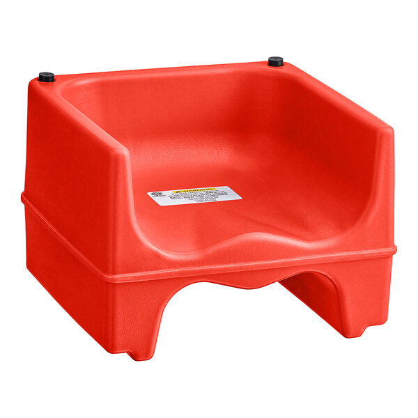 A red plastic Lancaster Table & Seating booster seat with a black handle.