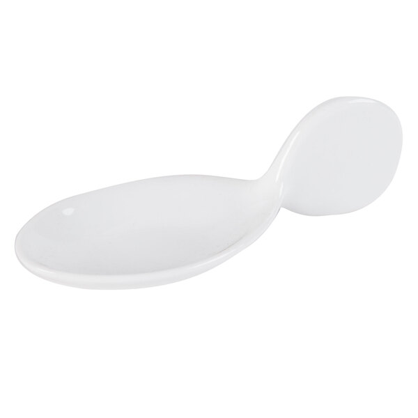 A white porcelain spoon with a spoon on it.