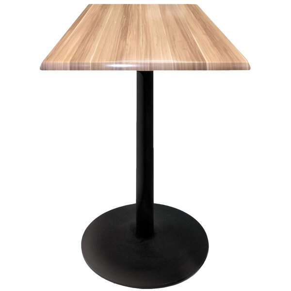 A Holland Bar Stool natural wood table top with a black round base.