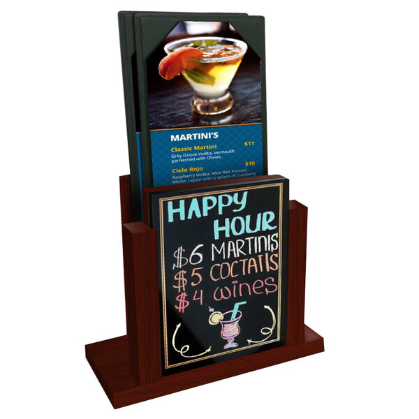 A mahogany wood Menu Solutions table stand with a wet erase board menu insert on a table with a drink.