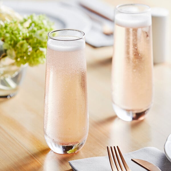 Two Acopa stemless champagne flutes on a table