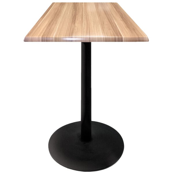 A Holland Bar Stool natural wood table top on a black round base.