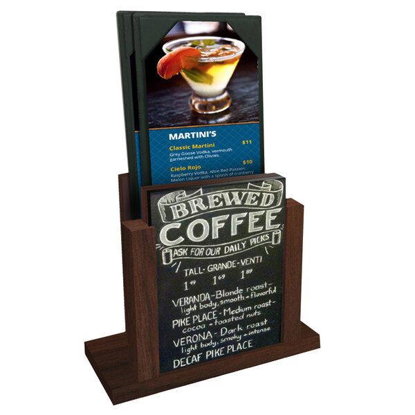 A Menu Solutions walnut wood menu holder with a chalk board insert on a counter with a drink.