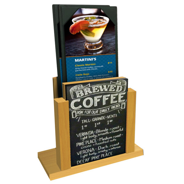 A Menu Solutions country oak wood menu holder with a chalk board insert on a table with a coffee cup.
