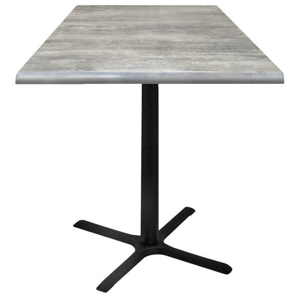 A Holland Bar Stool 36" square greystone outdoor bar height table with a black base.