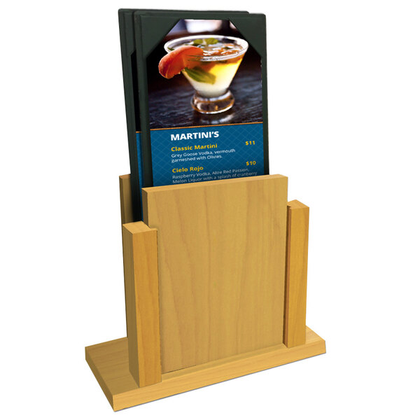 A Menu Solutions Country Oak wood stand with a menu sheet in it.
