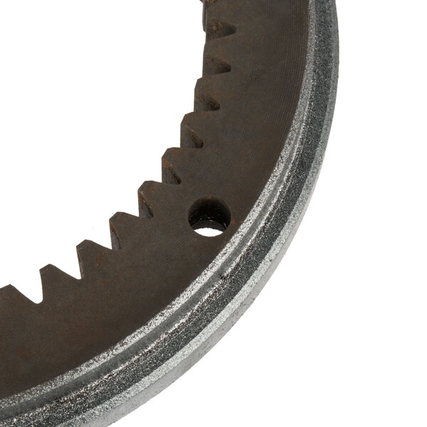 A close-up of a metal Avantco turning plate gear with teeth.