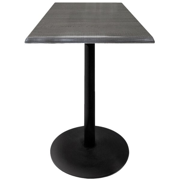 A Holland Bar Stool charcoal bar height table with a black base.