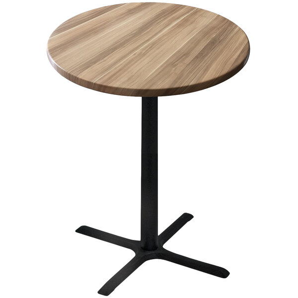 A round wooden table with a black base.