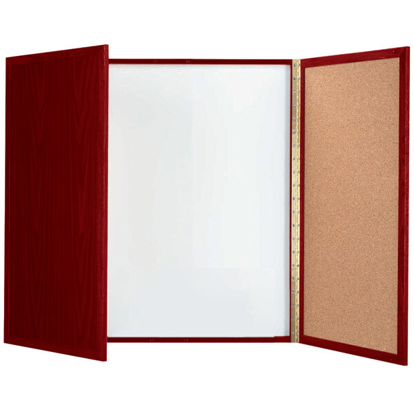 A cork board with a red frame and a white board inside.