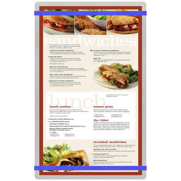 A Menu Solutions customizable brushed aluminum menu board with royal blue bands holding a menu with sandwiches and other food items.