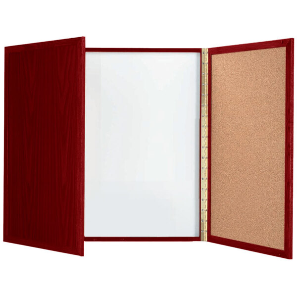 A cherry laminate planning board with a white board inside and a cork board on the outside with a red frame.
