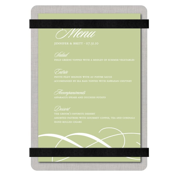 A Menu Solutions customizable brushed aluminum menu board with black bands holding a white menu card with black straps.