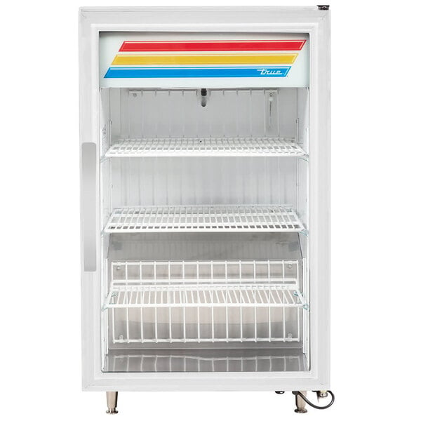 A white True refrigerated countertop merchandiser with shelves.