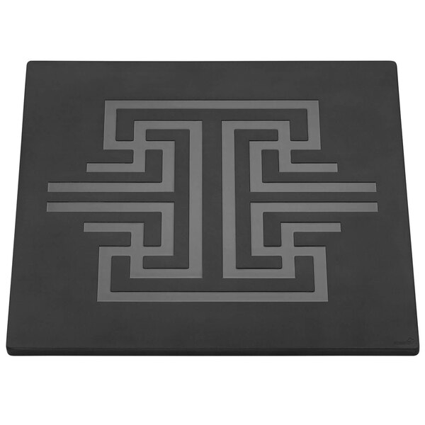 A black square mat with a reversible design in black and white.